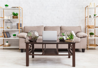 Scandinavian interior. Room with wooden table and florariums