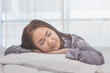 © sopradit - Asian woman sleep on  white pillow on bed in bedroom in holiday.happy relax time.