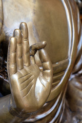 Wall Mural - Beautiful bronze Buddha statue hand, close up