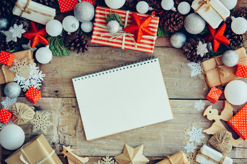Wall Mural - Christmas background with letter and gift boxes on the wooden ta