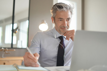 Businessman on video call in contemporary office