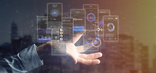 Poster - Businessman holding User interface screens with icon, stats and data 3d rendering
