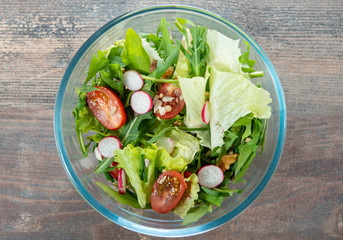 Plate with vegetarian salad of natural organic vegetables