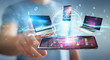 © sdecoret - Modern devices connected in businessman hand 3D rendering