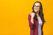 © denis_vermenko - Portrait of young beautiful woman wearing casual smiling with happy face looking and pointing to the side with thumb up.