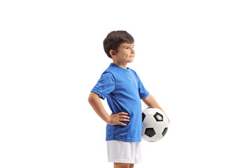 Wall Mural - Little boy with a football standing