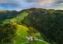 Aerial Shot Of Green Hills Of Slovenia At Sunrise
