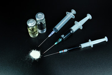 drug syringe and cooked heroin