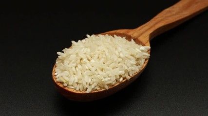 Canvas Print - Rice in a spoon close-up