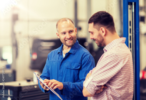 Cuadros en Lienzo auto service, repair, maintenance and people concept - mechanic with clipboard t