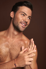 Wall Mural - Happy muscular young man posing on camera