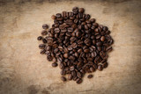 Fototapeta Kuchnia - Coffee beans roasted on rustic wood background