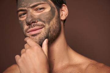 Wall Mural - Sexy self-important manful guy with face mask