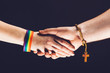 © Photocreo Bednarek - Gay and Christian person shaking hands