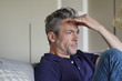 © goodluz - Mature man with bad headache at home