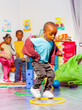 © Sergey Novikov - Little black boy jump in rings, physical activity
