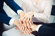 © rogerphoto - Business people group joining hands. Teamwork or meeting concepts