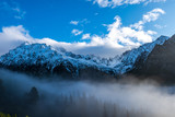 Fototapeta Góry - mist rising from valleys in forest in slovakia Tatra mountains