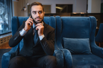 Wall Mural - Handsome young businessman wearing suit