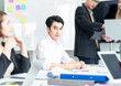 © kittipong - Teamwork business concept .Start up business people in modern office, working together having success. Multiethnic start-up business team on meeting in modern bright office interior brainstorming