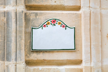 Wall Mural - Traditional Maltese home sign board at Gozo, Malta