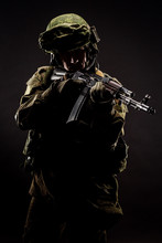 Russian Special Forces Soldier With Rifle On Dark Background. Army, Military And People Concept