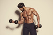 © mrbigphoto - Handsome Muscular Men Exercise With Weights