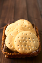 Traditional Chilean Hallulla Bread Rolls In Basket, Photographed On Dark Wood With Natural Light (Selective Focus, Focus On The First Roll)