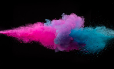 Wall Mural - Collision of two colored powders isolated on black