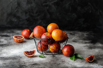 Wall Mural - Fresh ripe red oranges on dark background. Healthy orange fruits background many orange fruits. 