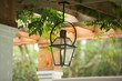 Upscale Luxury Outdoor Hanging Patio Classic Lantern  Lighting with a burning flame with curb appeal