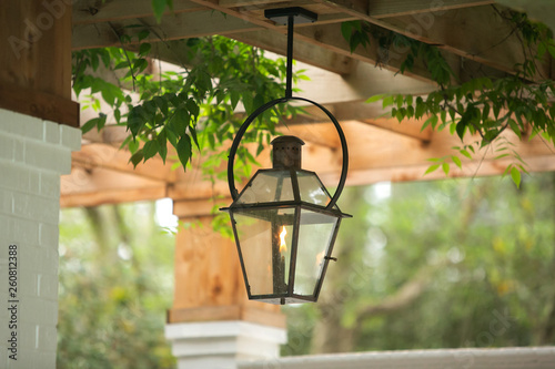 Upscale Luxury Outdoor Hanging Patio Classic Lantern  Lighting with a burning flame with curb appeal