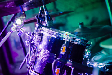 shiny drum set on a concert stage