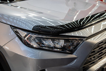 Headlight of grey modern car with LED light