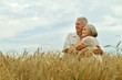 © aletia2011 - Portrait of senior couple resting at summer field