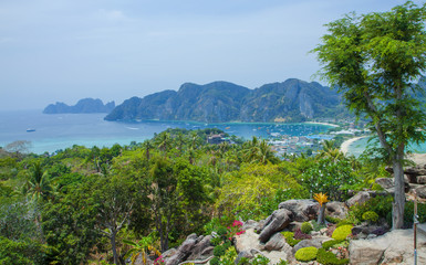 Beautiful view of the island with thin isthmus and two bays. Green mountains and tropic plants. Tropical island in the ocean, Phi-Phi island. Thailand.