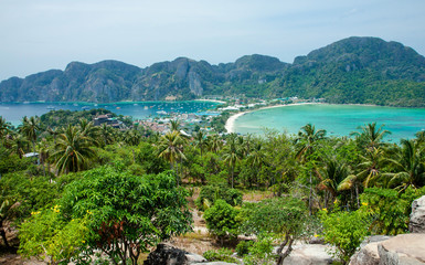 Beautiful view of the island with thin isthmus and two bays. Green mountains and tropic plants. Tropical island in the ocean, Phi-Phi island. Thailand.