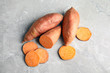 Flat lay composition with sweet potatoes on grey background