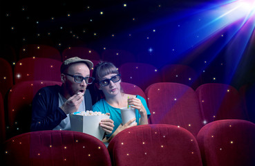 Wall Mural - Lovely couple watching 3D movie with little sparkling stars around