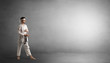 © ra2 studio - Small karate man fighting in an empty grey copy space