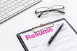 © 9dreamstudio - Review resumes of applicants set with keyboard and glasses white work desk background