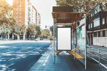 A Template Of A Blank Ad Poster Inside Of A Bus Stop; Vertical Information Banner Mock-up Placeholder In A Stop Of Public Transport With The Road Near; An Empty Billboard Mock-up In Urban Settings