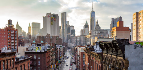 New York City - Panoramic view of the crowded buildings of the Manhattan skyline at sunset.