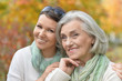 © aletia2011 - Close up portrait of senior woman with adult daughter in autumnal park