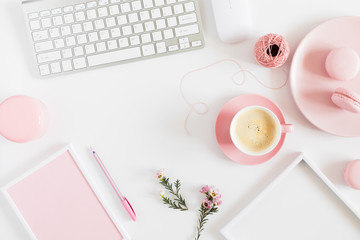 fashion beauty blogger working space with laptop keyboard, female fashion accessories, flowers, coff