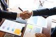 © Ngampol - Finishing up a discussion on meeting after collaboration, handshake of two business people after contract agreement to congratulation become a partner, collaborative teamwork