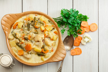 Wall Mural - Vegetable soup with ingredients carrot, cauliflower, potato and