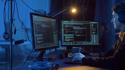 Poster - cybercrime, hacking and technology concept - female hacker in dark room creating code or using computer virus program for cyber attack