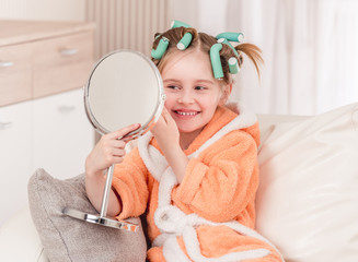 Wall Mural - Girl with curlers smiling