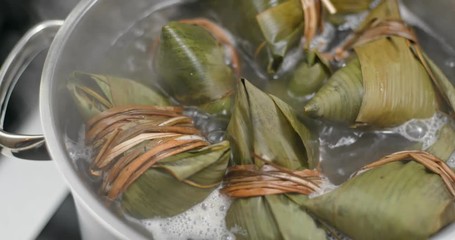 Wall Mural - Cook with stick rice bamboo dumpling at home